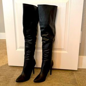 Thigh high black leather boots
